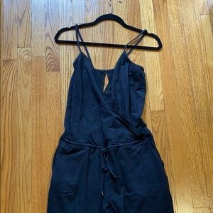 Body suit with pockets and cut out